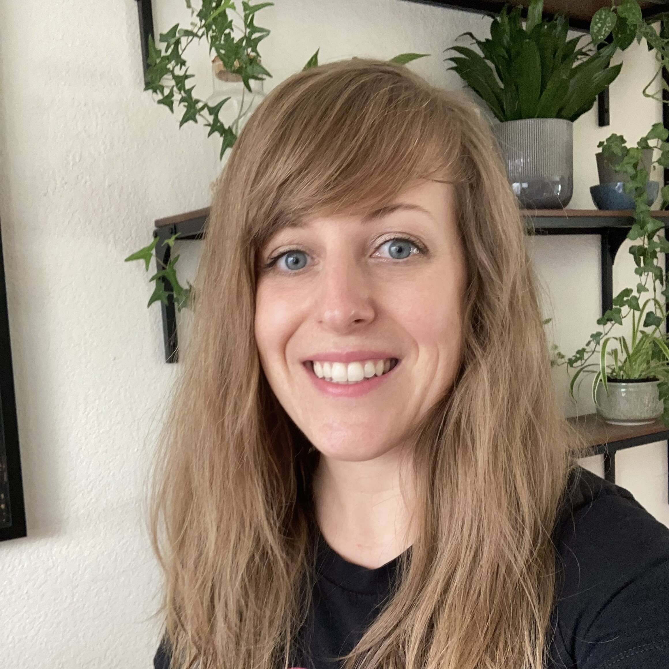 photo of a smiling woman with long hair